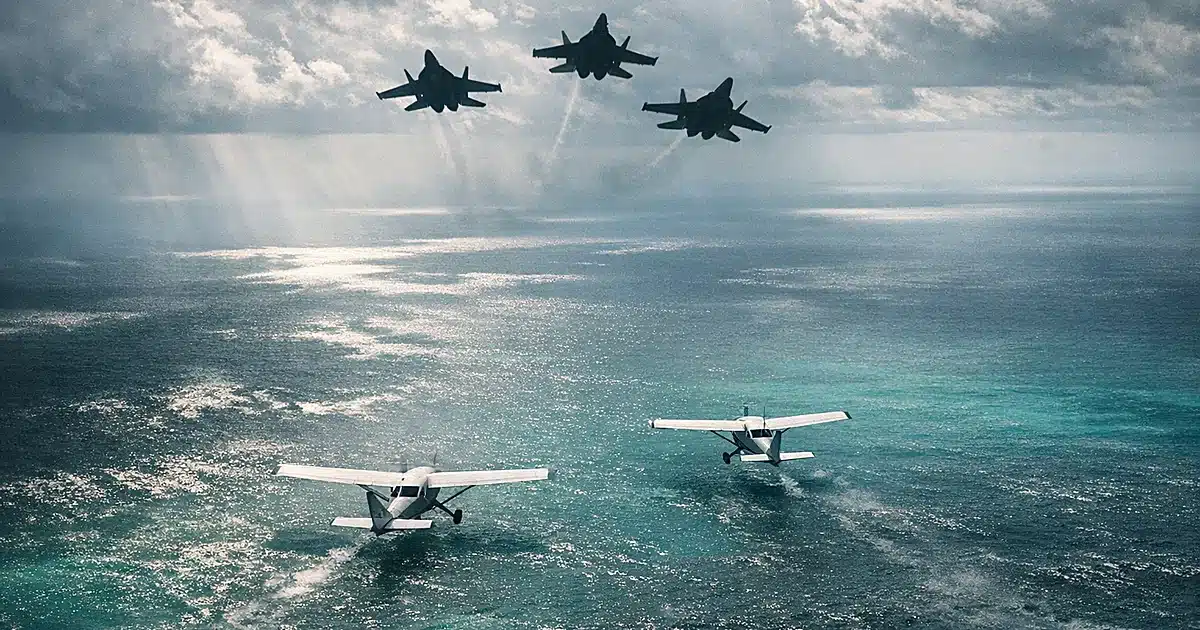 Silhouettes of civilian planes over Caribbean waters with military jets approaching from behind in threatening formation