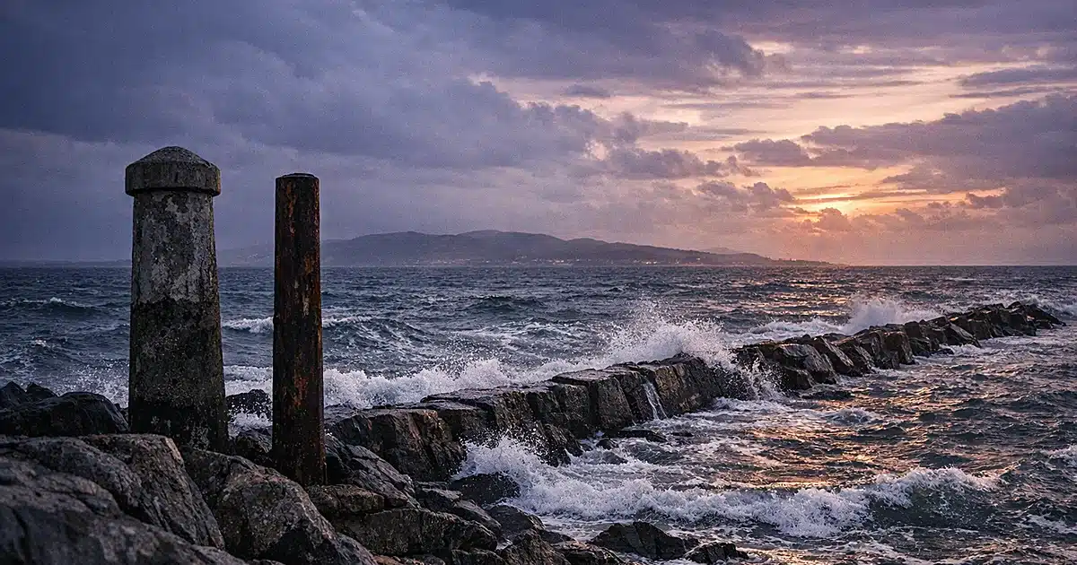 Irish Sea at dusk with border markers and choppy waters between distant shorelines