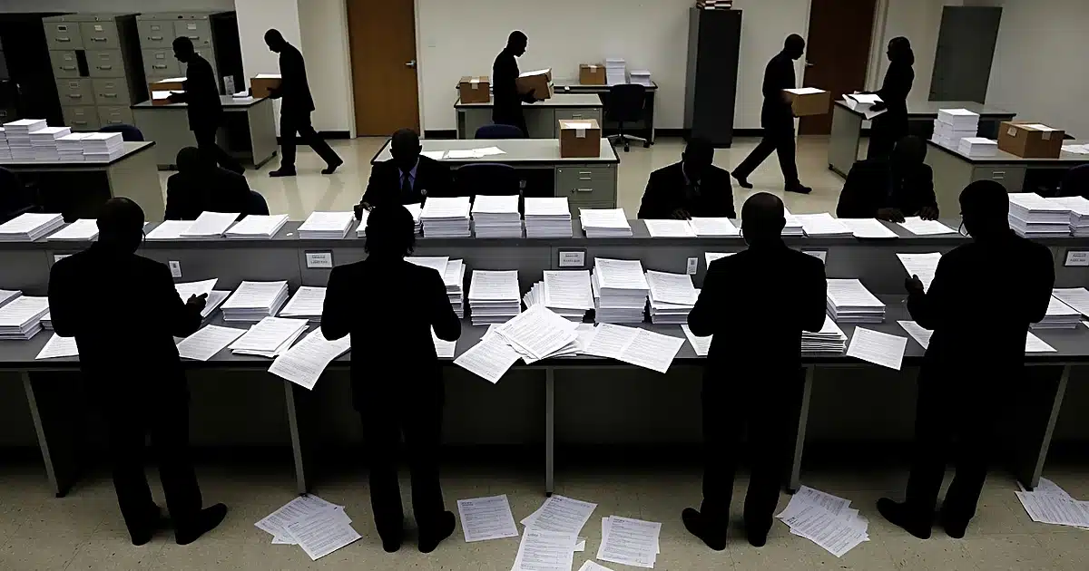 Federal courthouse office with silhouetted officials processing voter registration documents at counter